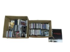 A large collection of music CDs, contained within two boxes, including a wide selection of classic