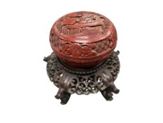 A Chinese cinnabar lacquer box and a pierced hardwood stand, both circa 19th century, box 9.5cm in