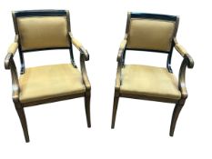 A pair of Regency style painted elbow chairs by Baker furniture, width 56cm, depth 54cm, height