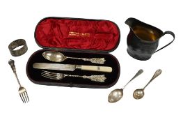 A George III silver helmet cream jug, London, 1809, a cased matched silver christening trio, three