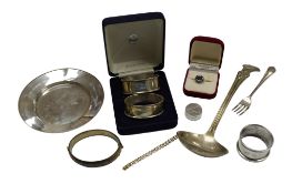 A George V silver stand by James Dixon & Sons, diameter 13.2cm, a silver fork, three silver napkin