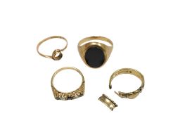 A late 20th century 9ct gold and black onyx signet ring, together with three other 9ct rings,