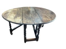 A 17th century oak gateleg table, width 160cm extended, depth 136cm, height 71cm