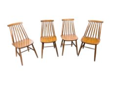 A set of four mid century stick back chairs, width 40cm, depth 42cm, height 80cm