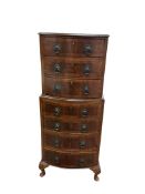 A reproduction small walnut bowfronted chest on chest, width 52cm, depth 42cm, height 115cm