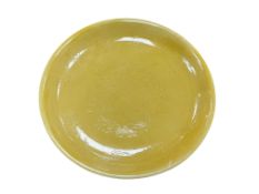 A Chinese porcelain yellow glazed ‘dragon’ dish, 26cm in diameter