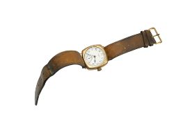 A gentleman’s 9ct Waltham manual wind wrist watch, lacking glass, on an associated leather strap.