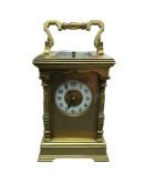 An early 20th century brass repeating carriage clock with Arabic dial and repeater, no key, 17cm