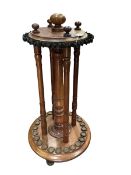 A late 19th / early 20th century walnut and oak revolving billiards cue stand,Along with a framed