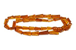 A single strand amber bead necklace, 54cm, gross weight 25.8 grams.