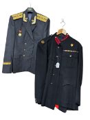 Two military uniforms, a post WWII formal police uniform comprising jacket and trousers with medal