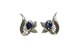 A pair of sapphire earrings, of foliate design, set with oval sapphires, in white gold, length 2.2cm
