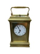 A late Victorian brass cased repeating carriage clock with Arabic dial, repeater and key, 17cm high