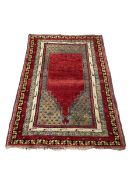 A Turkish red ground prayer rug with stepped mirhab, 153 x 104cm