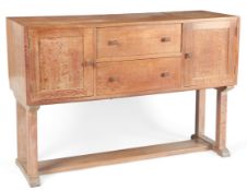 Heal's of Tottenham Court Road: A Cotswold School style limed oak dresser/sideboard