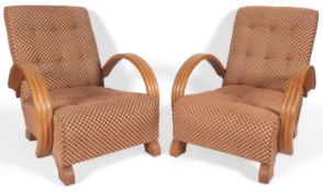 A pair of Art Deco style slipper lounge chairs