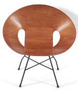 Manner of Eddie Harlis (German, 1928-1985) for Thonet: A bent walnut plywood and copper studded tub