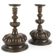 A pair of large Arts & Crafts brass candlesticks