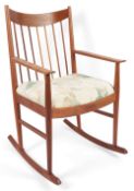Arne Vodder (Danish, 1926-2009) for Sibast: A teak rocking chair