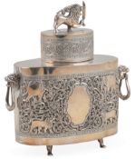 An early 20th century Sri Lankan white metal two handled tea caddy and cover, of shaped oval form,