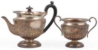 A late Victorian demi-fluted silver tea pot and matching two handled sugar bowl, by The Goldsmiths &
