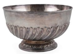 A late Victorian demi-spiral fluted silver punch bowl, by Goldsmiths & Silversmiths Co, with