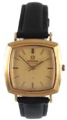 A gentleman's 1960's 18ct gold Omega automatic wrist watch, with shaped square yellow dial and baton
