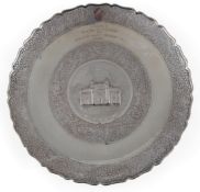 An early to mid 20th century Indian colonial white metal presentation plaque, embossed with the