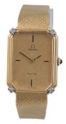 A lady’s 750 yellow metal and four stone diamond set Omega de Ville dress wrist watch, with