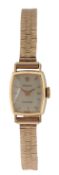 A lady's early 1980's 18k Rolex Precision manual wind wrist watch, on an associated 9ct gold