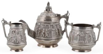 A late 19th/early 20th century Indian Colonial white metal three piece tea set, of conical Swami