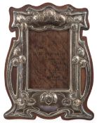 An Edwardian Art Nouveau silver mounted photograph frame, by J. Aitkin & Son, mounted on oak, of