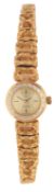 A lady's 1970's 18ct gold Omega manual wind cocktail wrist watch, on a textured 18ct gold Omega