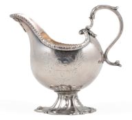 A late George II silver pedestal sauceboat, by Fuller White, with acanthus leaf capped handle,