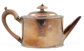 A George III silver oval teapot, by Andrew Fogelberg & Stephen Gilbert, with beaded borders and