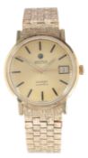 A gentleman's 9ct gold Roamer Limelight Automatic wrist watch, on a textured 9ct gold brick link