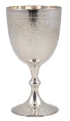 A late Victorian silver goblet by Walker & Hall, with engraved foliate decoration, on circular