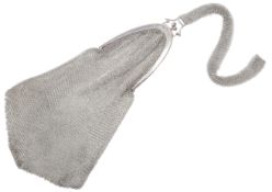 An Art Deco silver purse, circa 1920, the bag of mesh linking with a looped handle of silver chain
