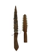 Two shark tooth daggers, likely Pacific Islands, along with a West African one string fiddle, and