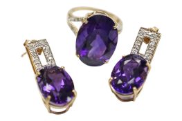 recent 9ct gold and single stone oval cut amethyst set ring, with diamond set split shoulders,