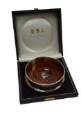 An Elizabeth II silver mounted wine coaster by Asprey & Garrard, London, 2000, diameter 12.4cm, in