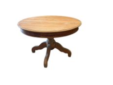 A circular pine breakfast table on pedestal base, diameter 119cm, height 79cm