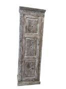 An Indian carved hardwood cabinet, width 72cm, depth 46cm, height 219cm