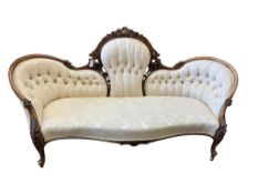 A Victorian carved walnut double spoon back settee, width 200cm, depth 70cm, height 104cm
