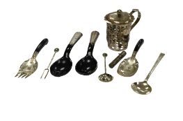 A Chinese single handled pierced white metal cup holder, with hinged cover(lacking glass insert),