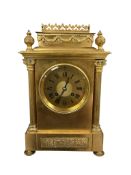 A 19th century French ormolu mantel clock with pierced swagged pediment, height 32cm.