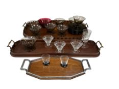 Two Edwardian inlaid mahogany tea trays, an Art Deco tray with shot glasses and assorted other