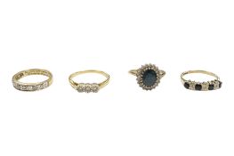 A yellow metal and three stone diamond ring, stamped 18ct, size P, together with three 9ct gold