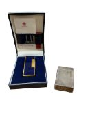 A Dunhill lighter, with box and a Dupont lighter.