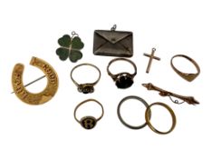 A collection of jewels, comprising: a silver envelope charm containing American postage stamps,